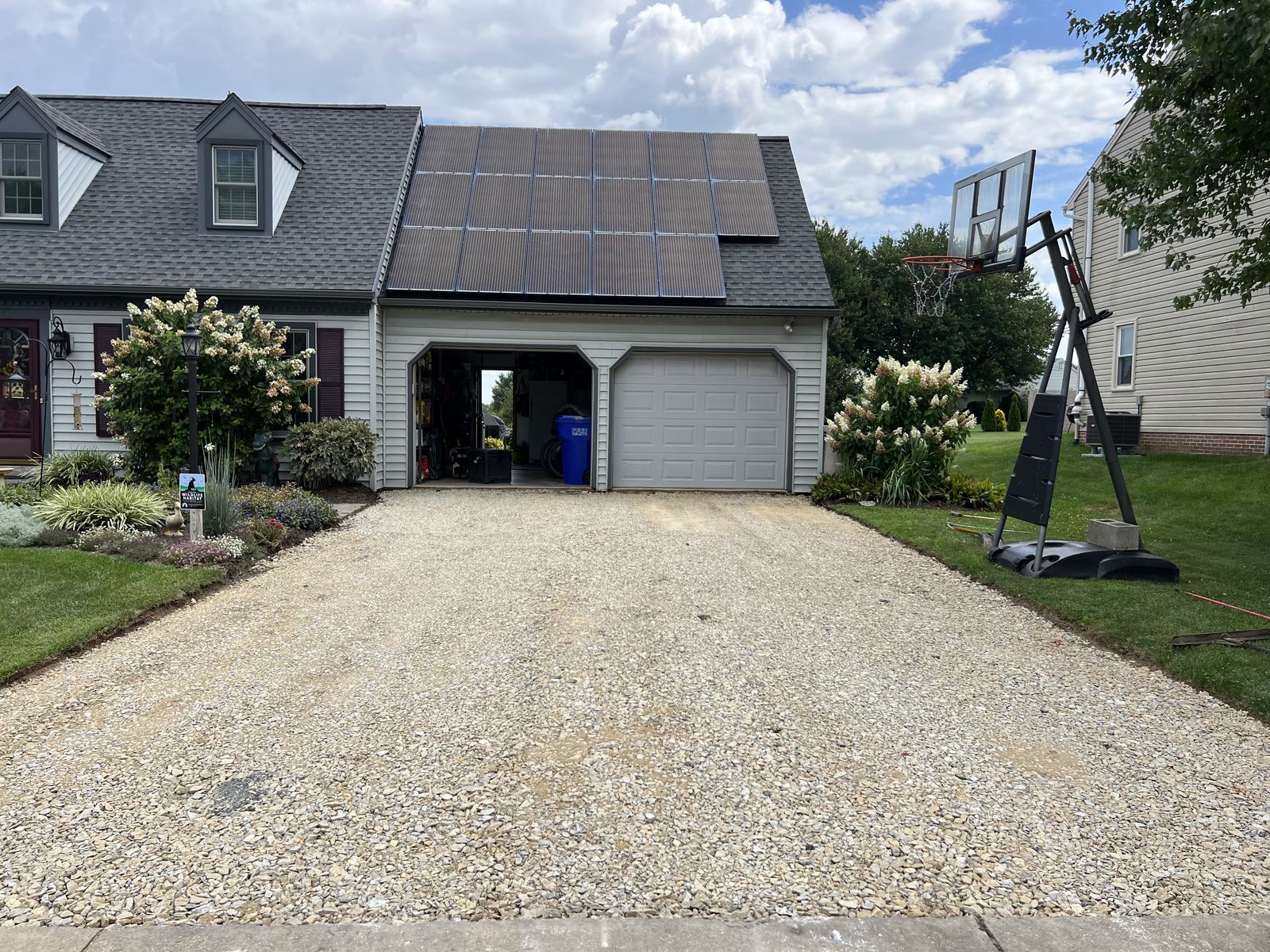 Graded and compacted stone base before asphalt driveway paving